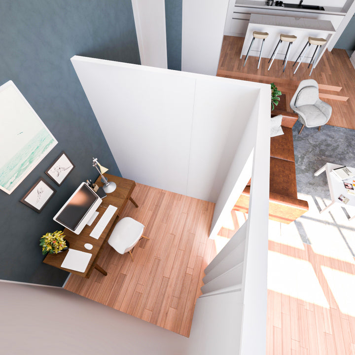 Top view of a modern home office with L-shaped partition wall, wooden desk with computer and lamp, adjacent to a living room with brown couch and kitchen with bar stools.