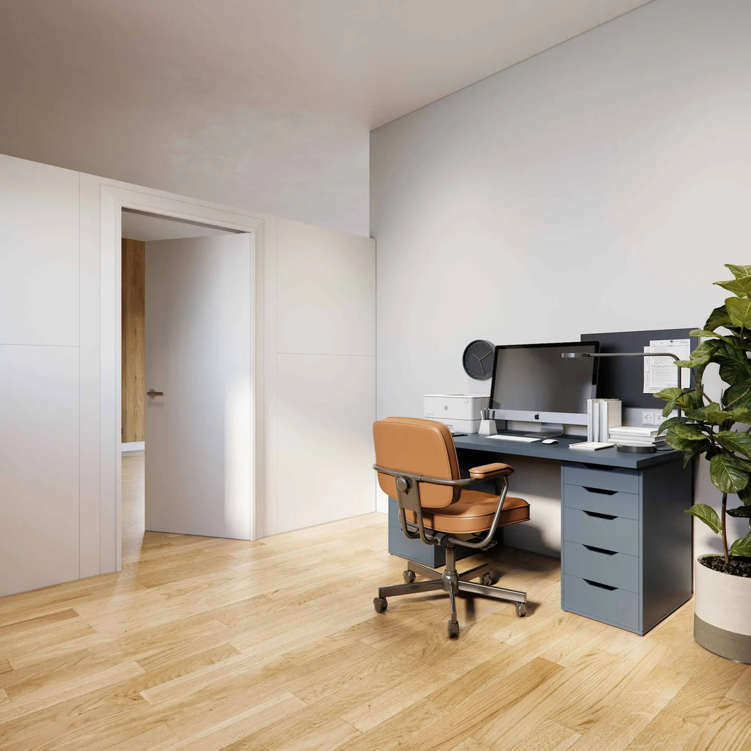 A room divider with a swing door closing of a space and creating a private home office. 