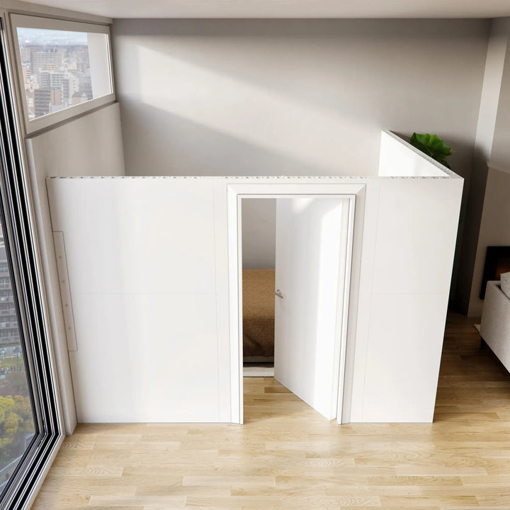 Mounted L-shaped modular temporary partition wall kit creating a private room in the corner of a livingroom with a swing door for full privacy